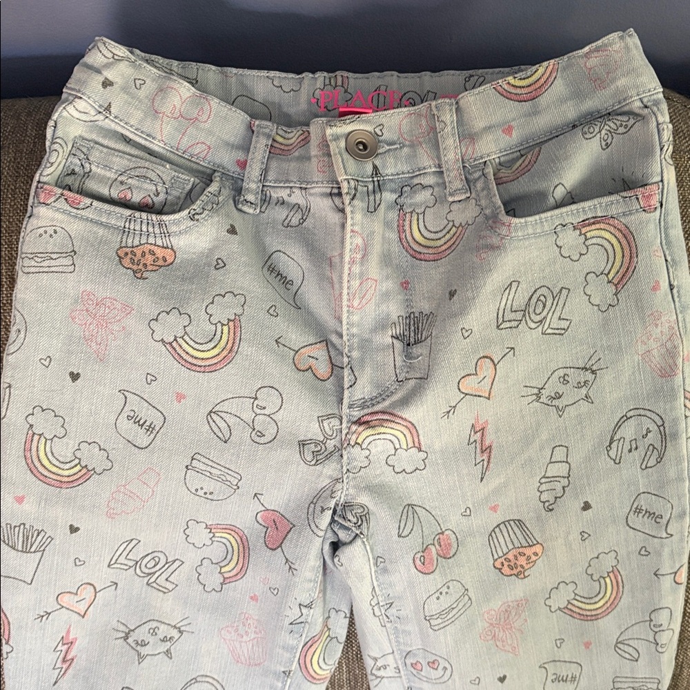 Place Light Blue Jeans with Graphic Designs